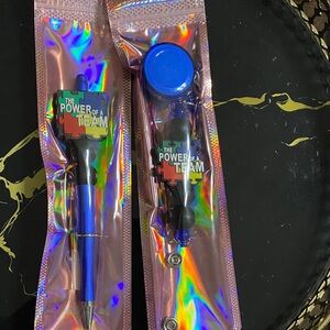 The Power of a Team Pen and Badge Reel.